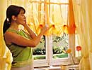 Woman orange curtains